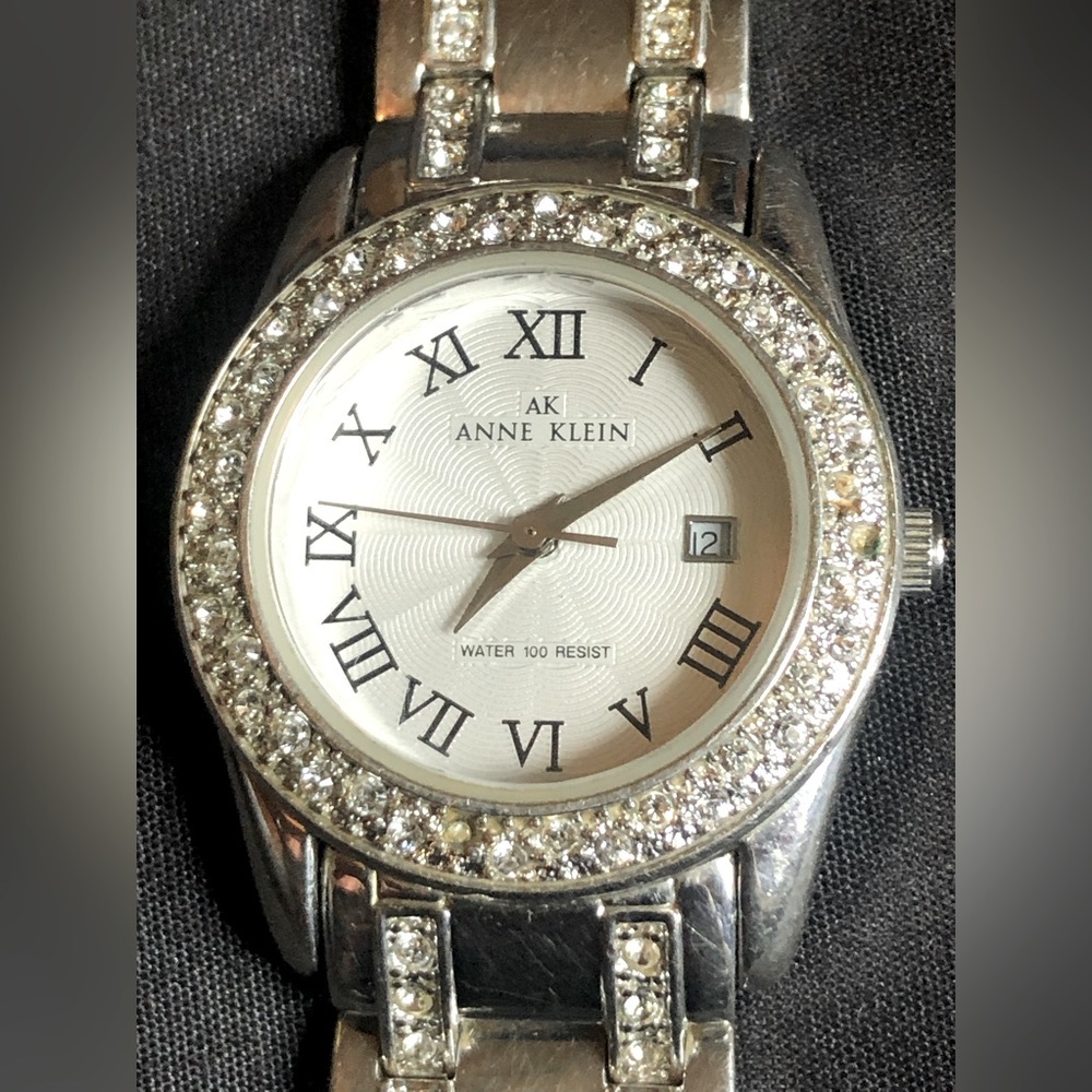 Anne Klein silver Tone beautiful dial crystal around the bezel day date at 3
